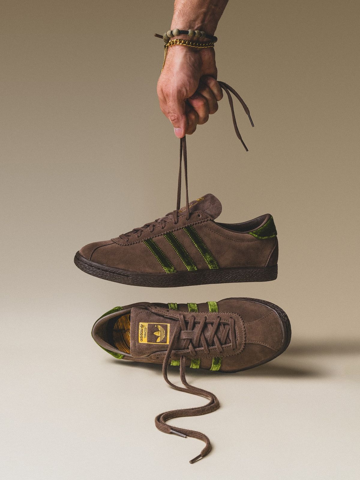 A pair of brown sneakers in a city setting
